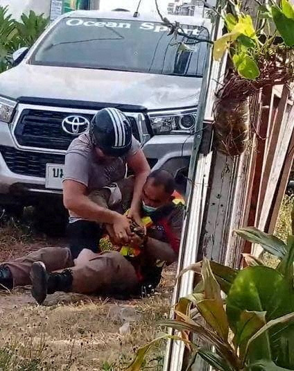 A tourist from New Zealand scuffles with a police officer in Phuket