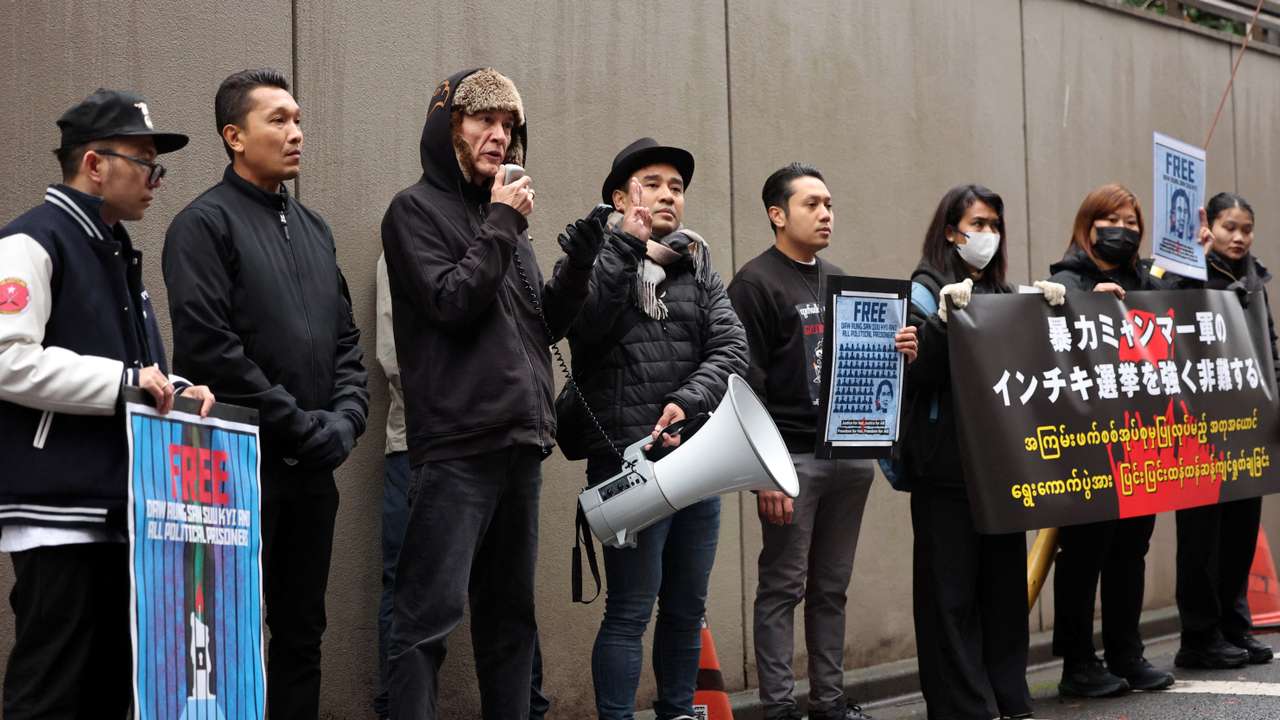Kim Aris, the son of Aung San Suu Kyi, takes part in a protest rally denouncing an upcoming election in Tokyo