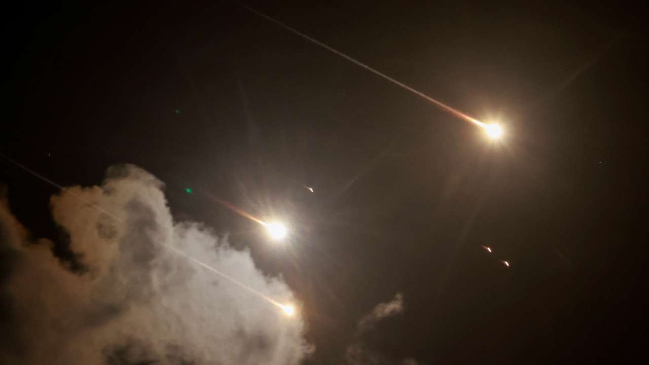 Projectiles are seen in the sky after Iran fired a salvo of ballistic missiles, amid cross-border hostilities between Hezbollah and Israel, as seen from Tel Aviv