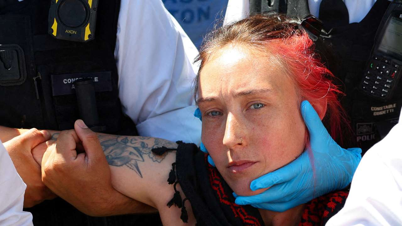 People gather in Parliament Square calling for the de-proscription of the Palestine Action group, in London