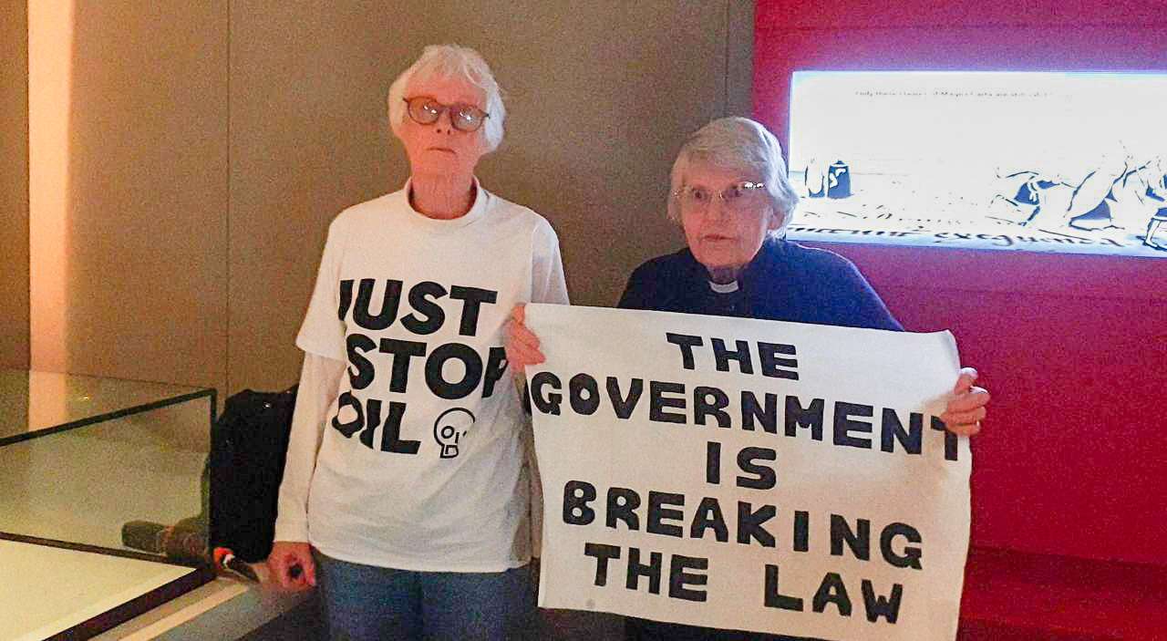 Elderly climate activists damage Magna Carta case at British Library, in London