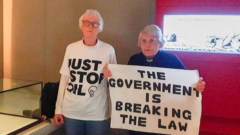 Elderly climate activists damage Magna Carta case at British Library, in London