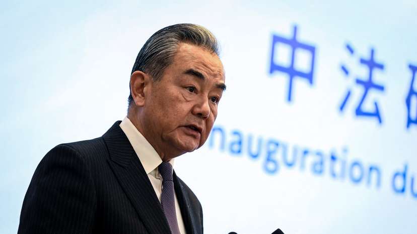 Chinese Foreign Minister Wang Yi delivers a speech during China-France carbon neutrality launching ceremony at Peking University in Beijing