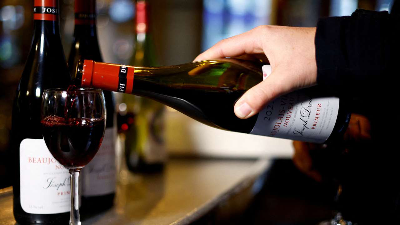 FILE PHOTO: Parisians celebrate Beaujolais Nouveau wine in Paris