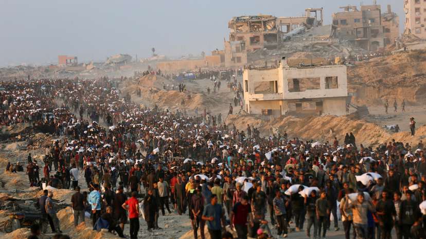 FILE PHOTO: Palestinians gather to receive aid supplies in Beit Lahia