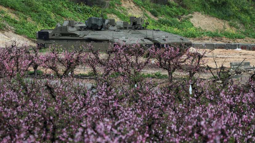 Israeli military vehicles are parked on the Israeli side of the border with Lebanon, amid escalation between Iran-backed Hezbollah and Israel and the U.S.-Israeli conflict with Iran