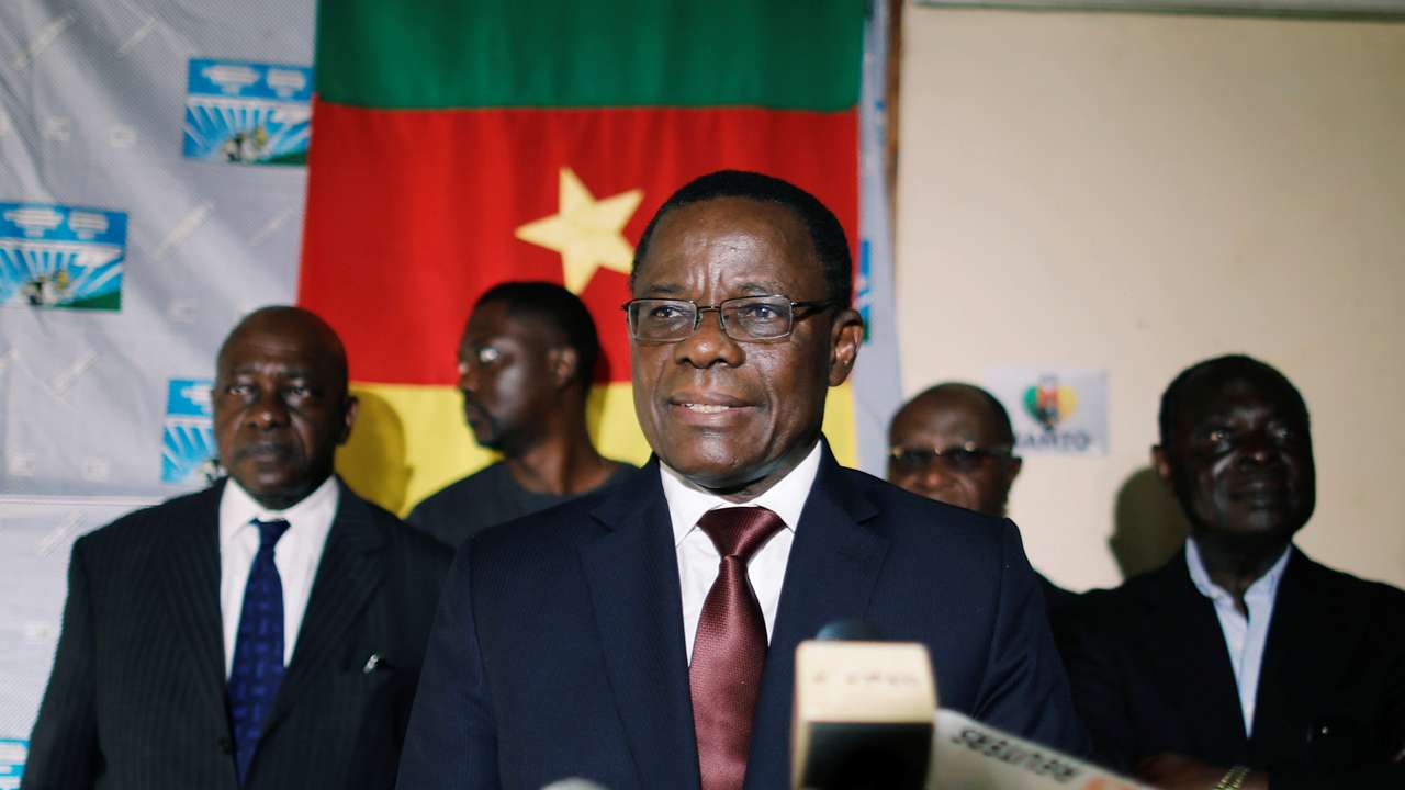 Maurice Kamto, a presidential candidate of Renaissance Movement (MRC), reacts as he holds a news conference at his headquarter in Yaounde,