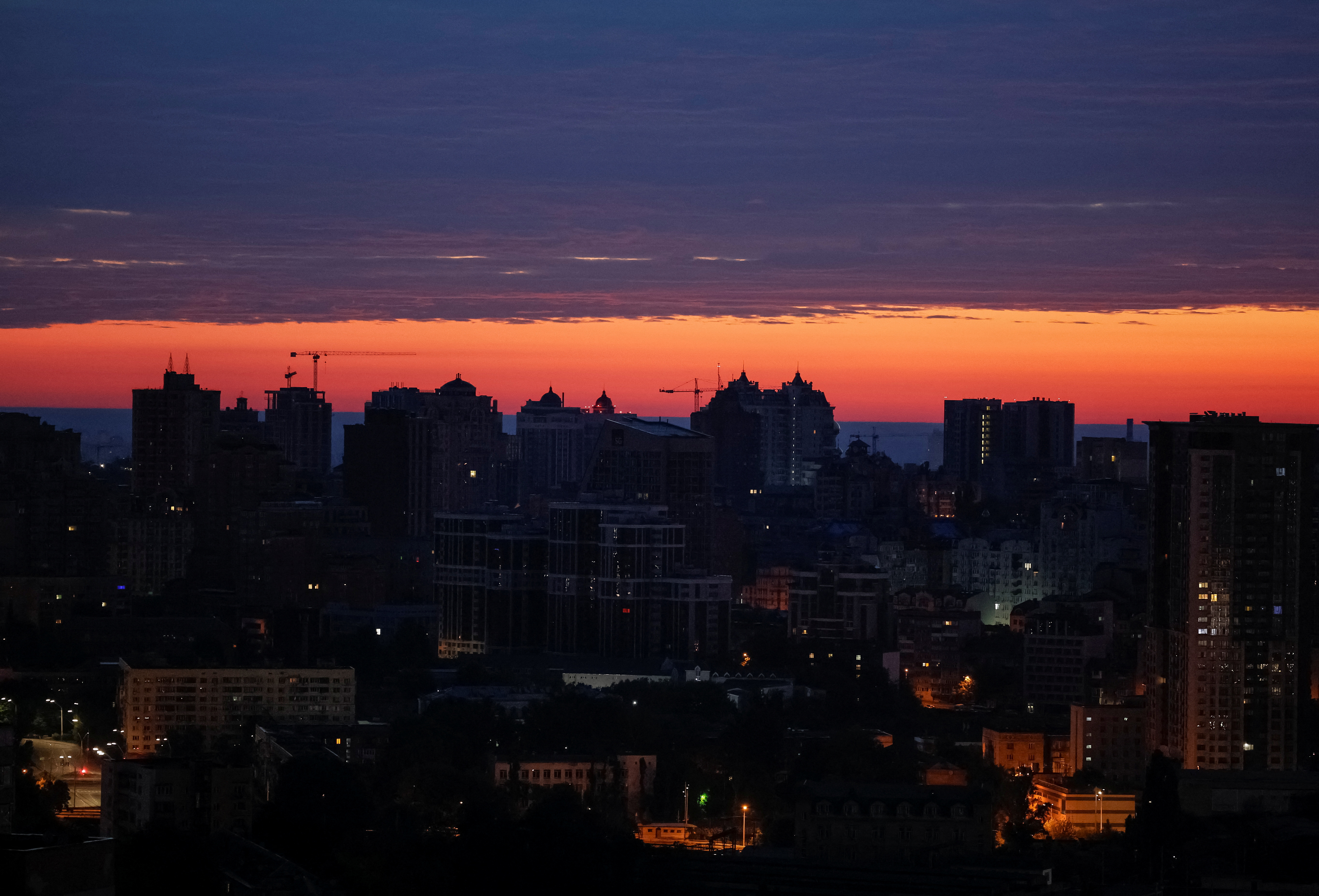 A view of the city at sunrise during an air raid alert in Kyiv