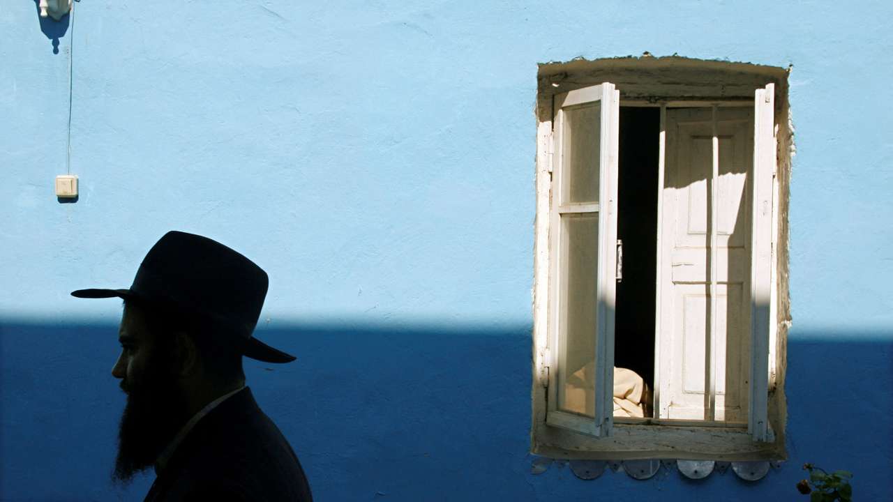 FILE PHOTO: A rabbi walks in the courtyard of a synagogue in the ancient city of Debent on the Caspian Sea coast in Russia's Caucasus region of Dagestan