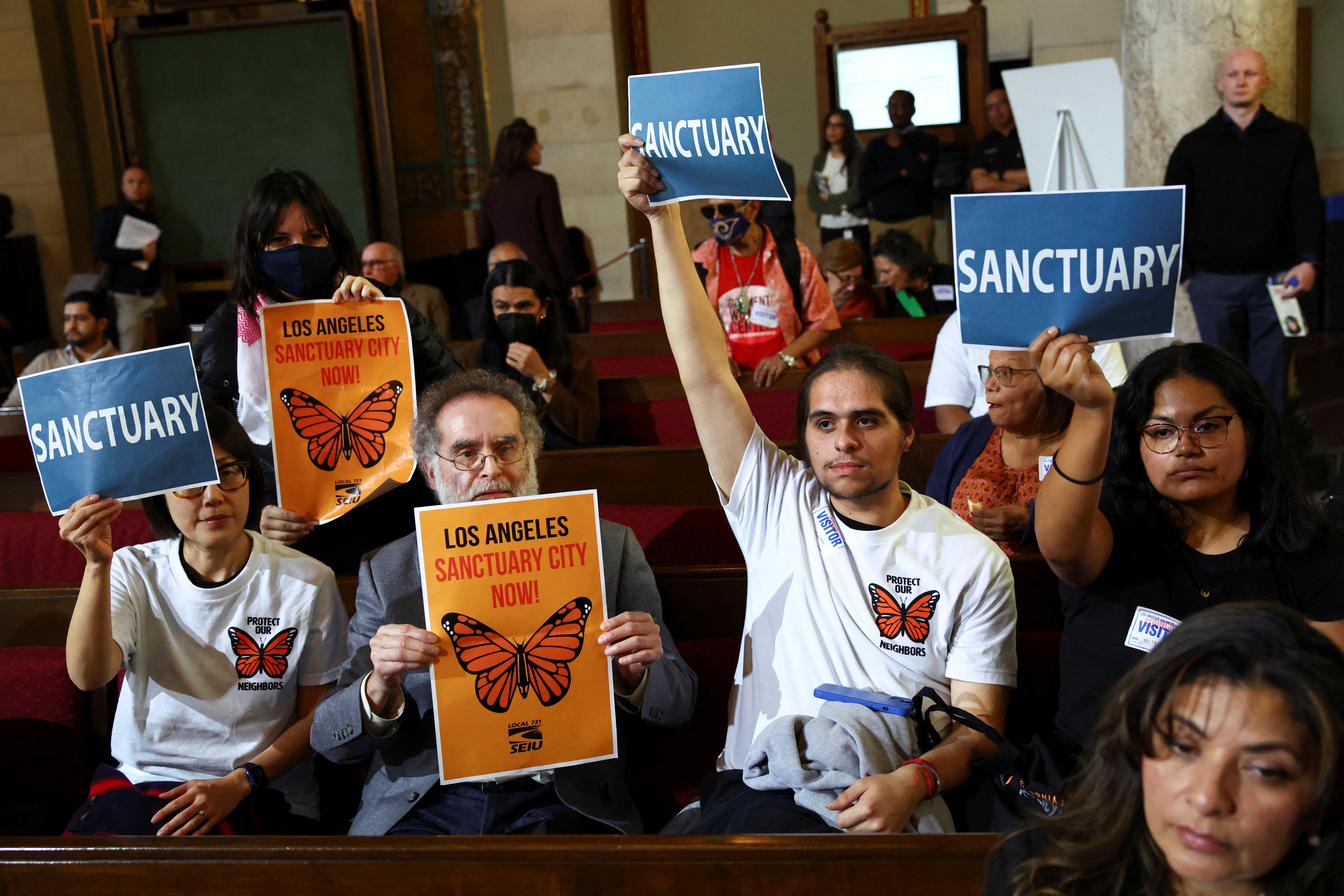 People attend a pro-immigration rally, in Los Angeles