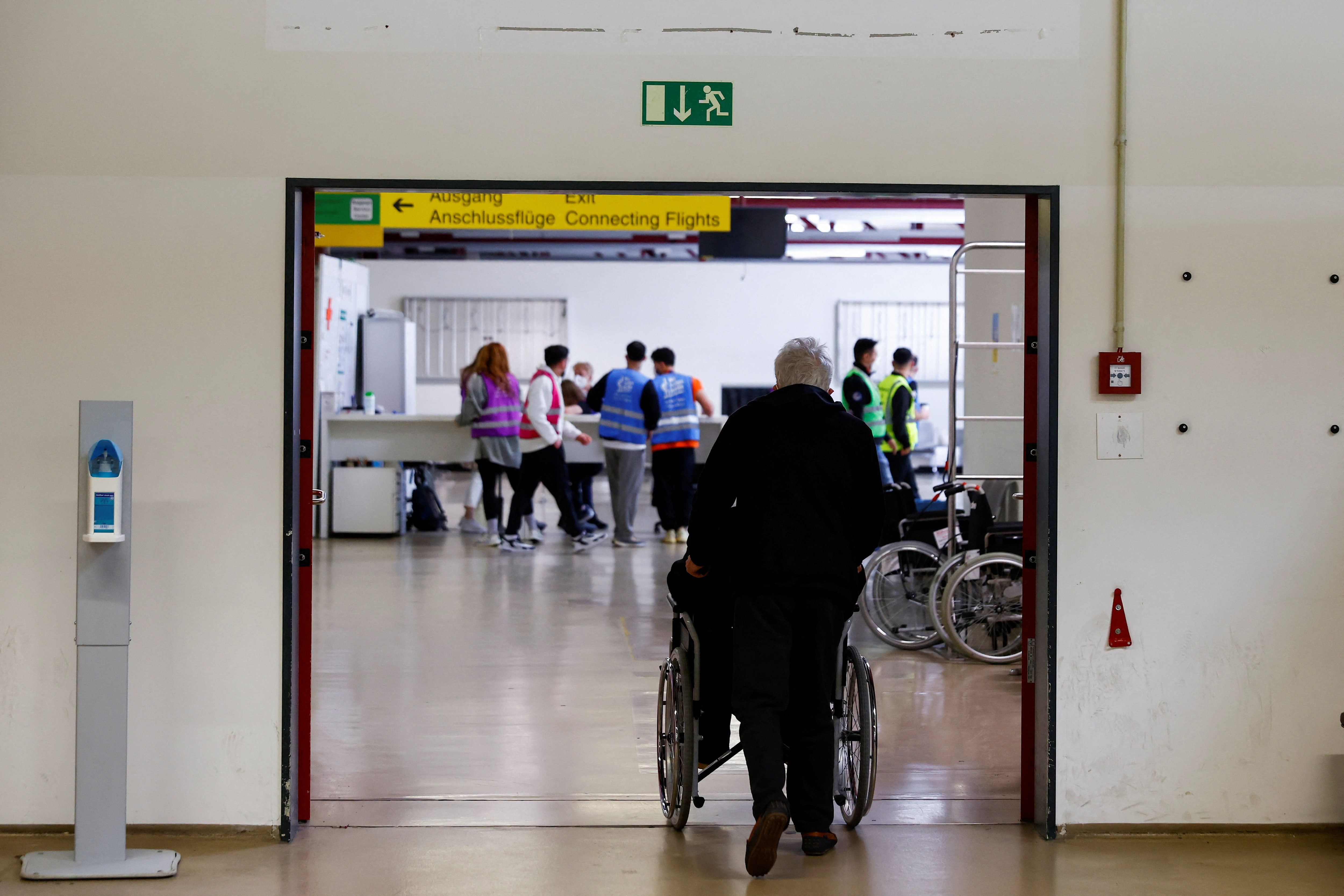 People arrive at the accommodation centre for refugees from Ukraine at the former Tegel airport in Berlin