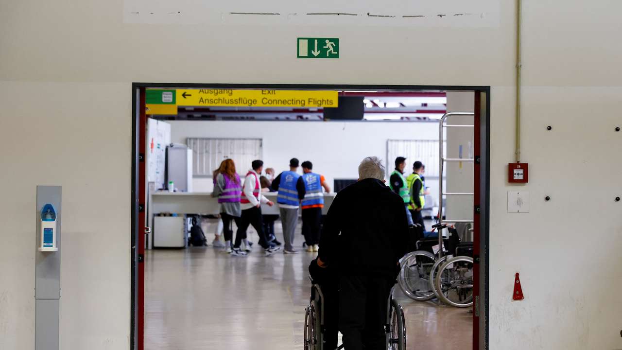 People arrive at the accommodation centre for refugees from Ukraine at the former Tegel airport in Berlin