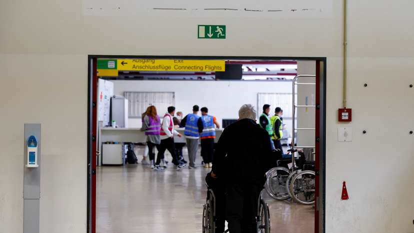 People arrive at the accommodation centre for refugees from Ukraine at the former Tegel airport in Berlin