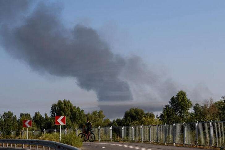 FILE PHOTO: Smoke rises during a Russian missile and drone attack on outskirts of Kyiv