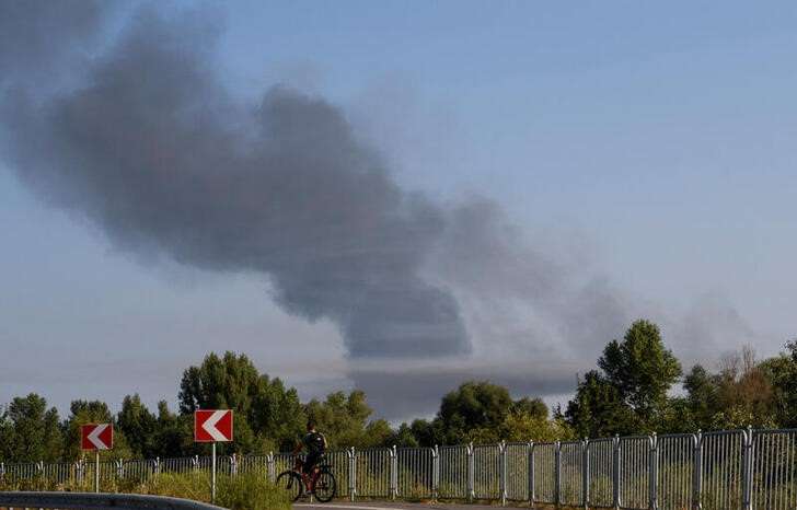 FILE PHOTO: Smoke rises during a Russian missile and drone attack on outskirts of Kyiv