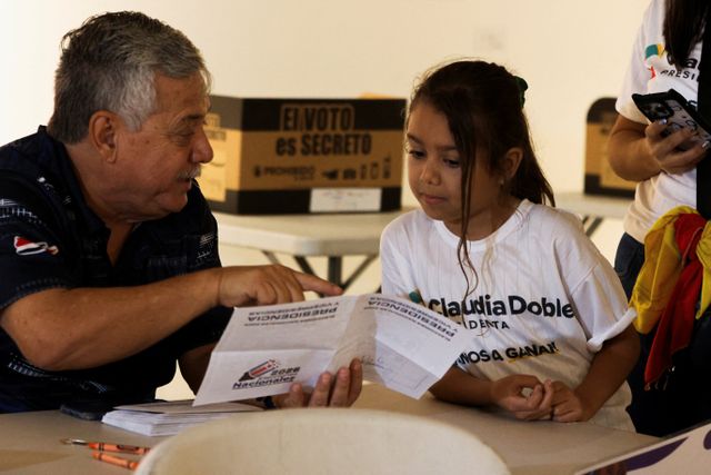 Children take part in a symbolic election at the Children's Museum during Costa Rica's general election day in San Jose