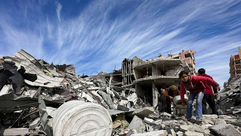 Residents inspect damages caused to Zeitoun neighborhood, in Gaza City