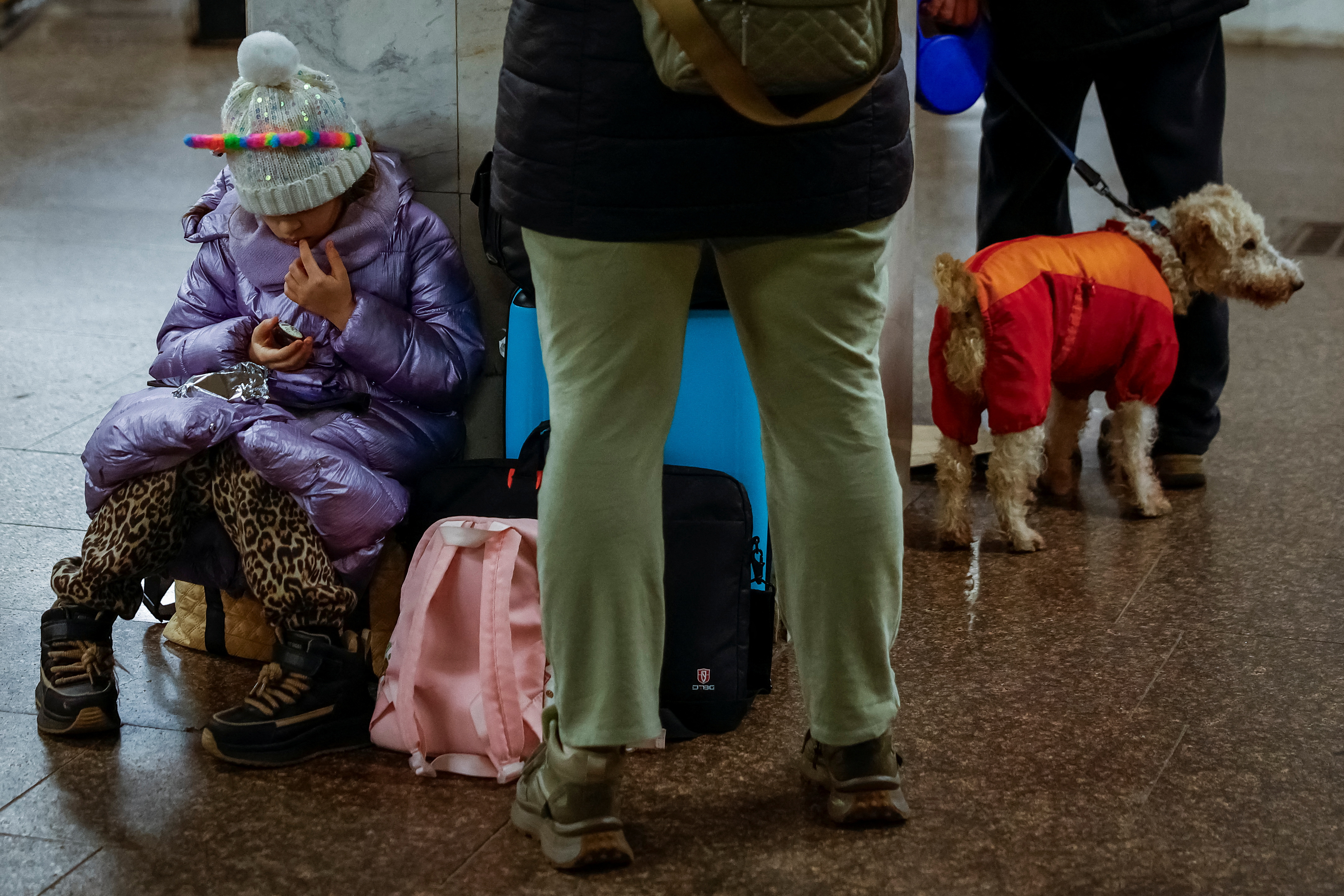 People take shelter inside a metro station during a Russian military strike in Kyiv