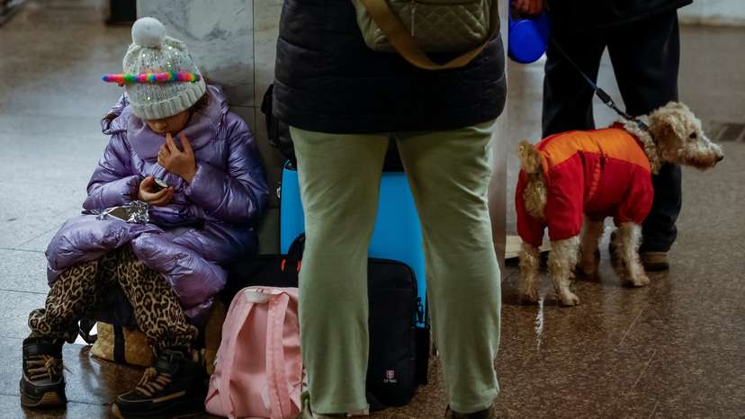 People take shelter inside a metro station during a Russian military strike in Kyiv