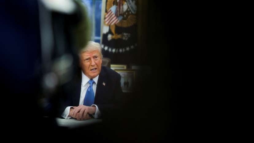 U.S. President Donald Trump signs an executive order in the Oval Office at the White House