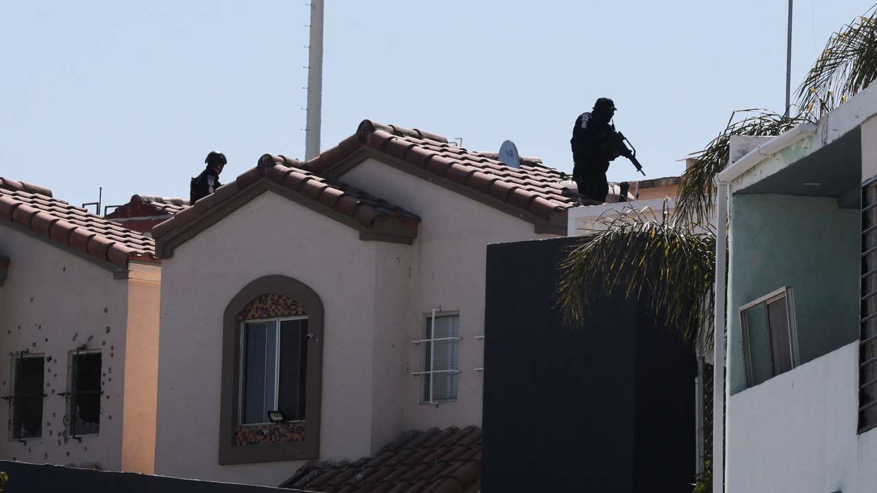 Security forces operate near a crime scene where a U.S. citizen shot and killed a state Mexican police officer, in Tijuana