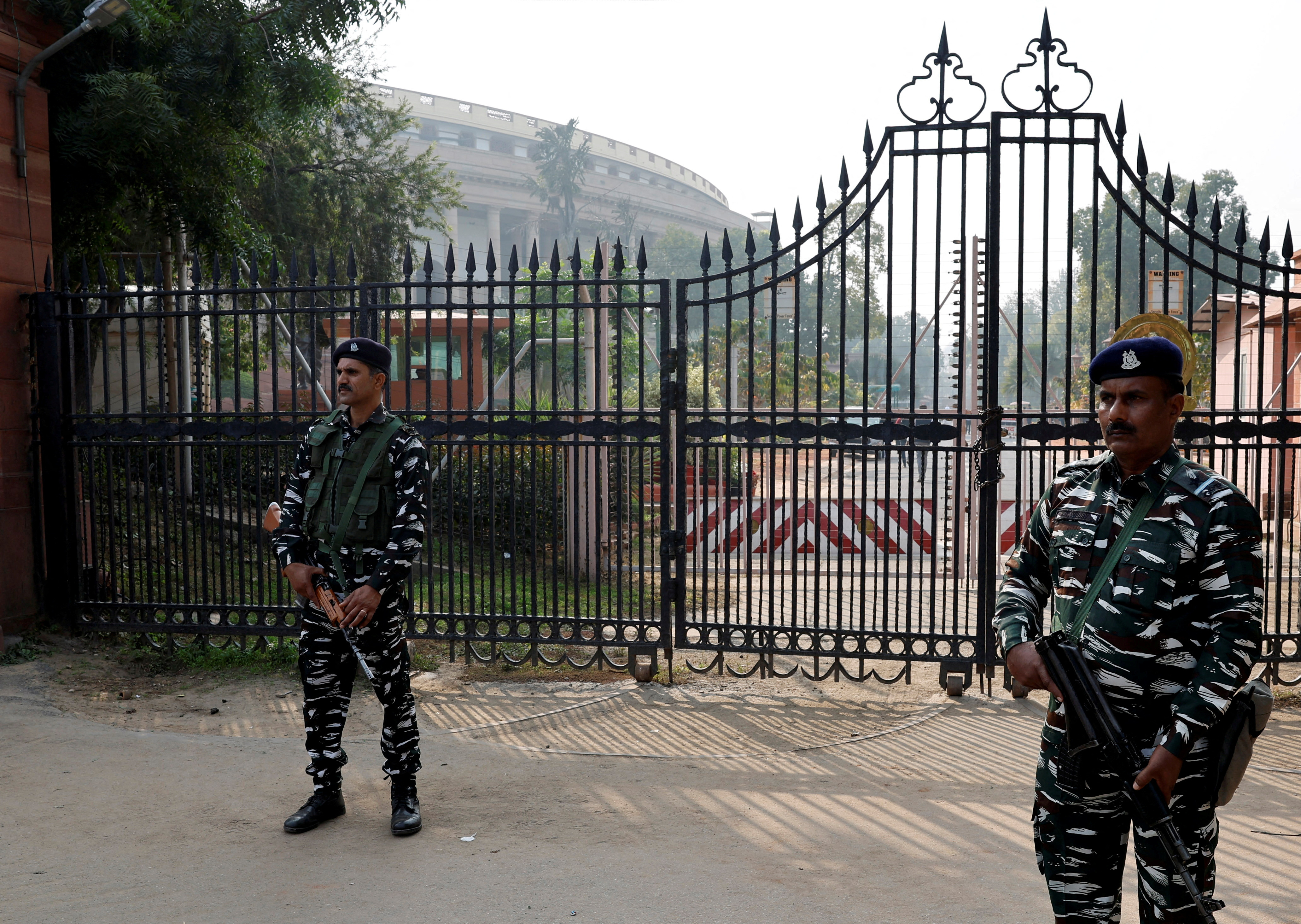 FILE PHOTO: Security force personnel stand guard outside the parliament premises, in New Delhi