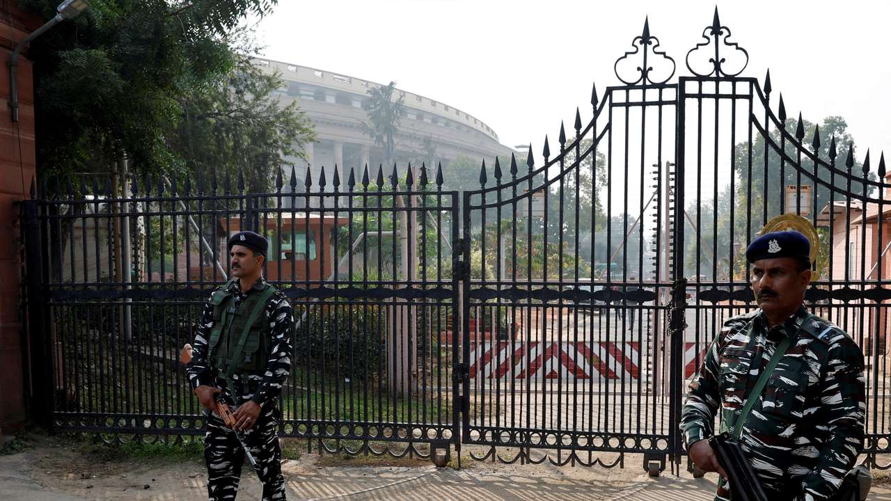 FILE PHOTO: Security force personnel stand guard outside the parliament premises, in New Delhi