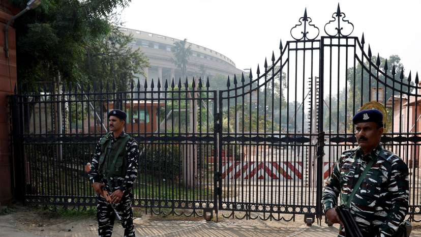 FILE PHOTO: Security force personnel stand guard outside the parliament premises, in New Delhi