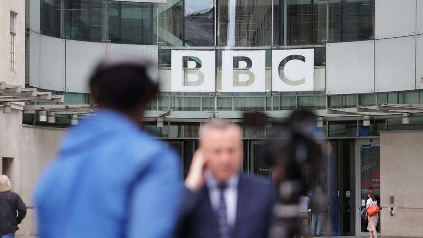 Journalists report outside BBC headquarters in London