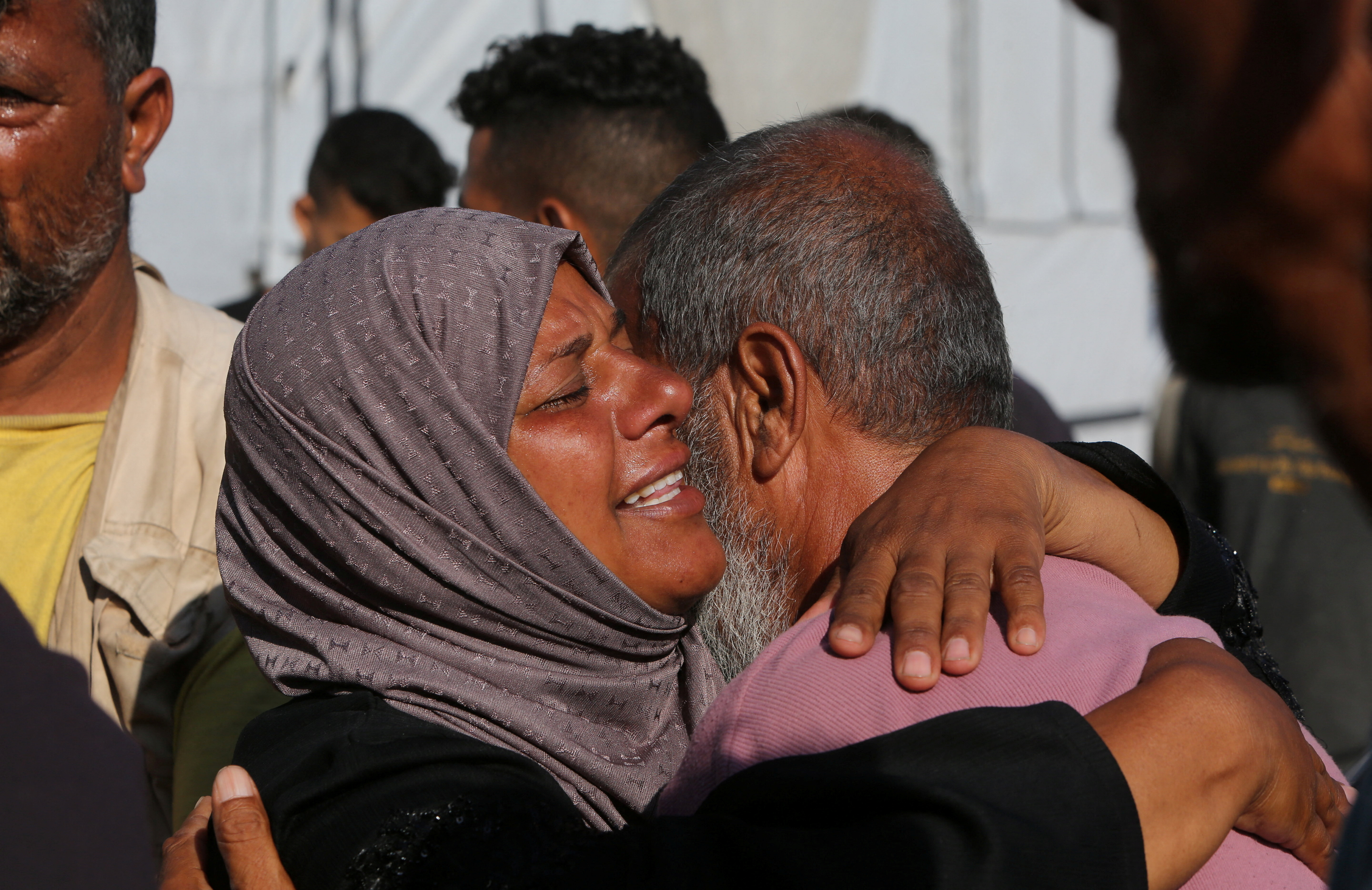 People mourn Palestinians who were killed in an incident while seeking aid in Khan Younis, at Nasser hospital in Khan Younis