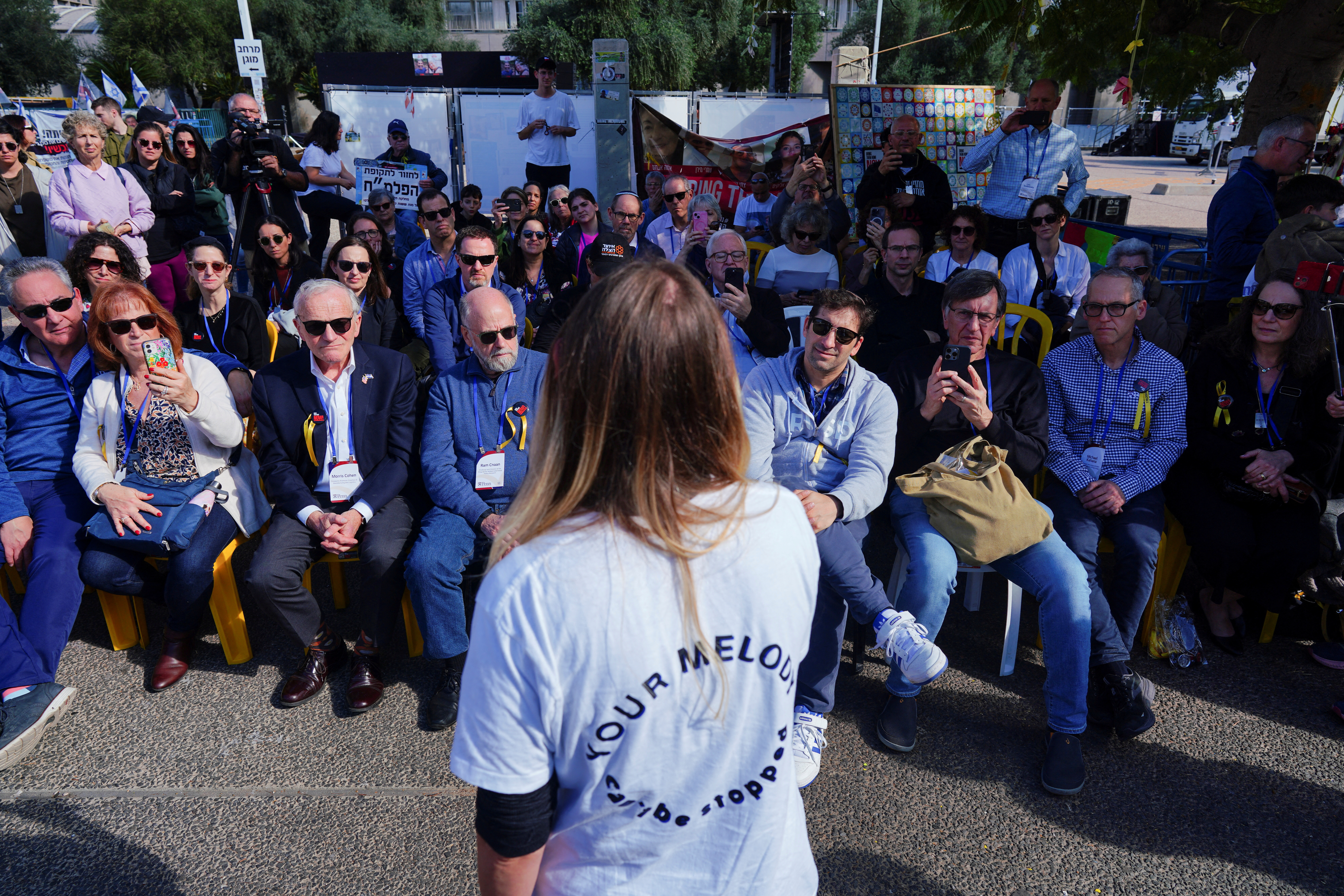Faculty and representatives from the University of Pennsylvania visit a plaza, in support of the families of hostages in Tel Aviv