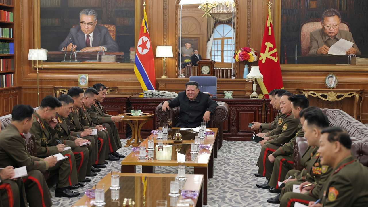 North Korean leader Kim Jong attends a meeting with officers of the army's overseas operation, in Pyongyang