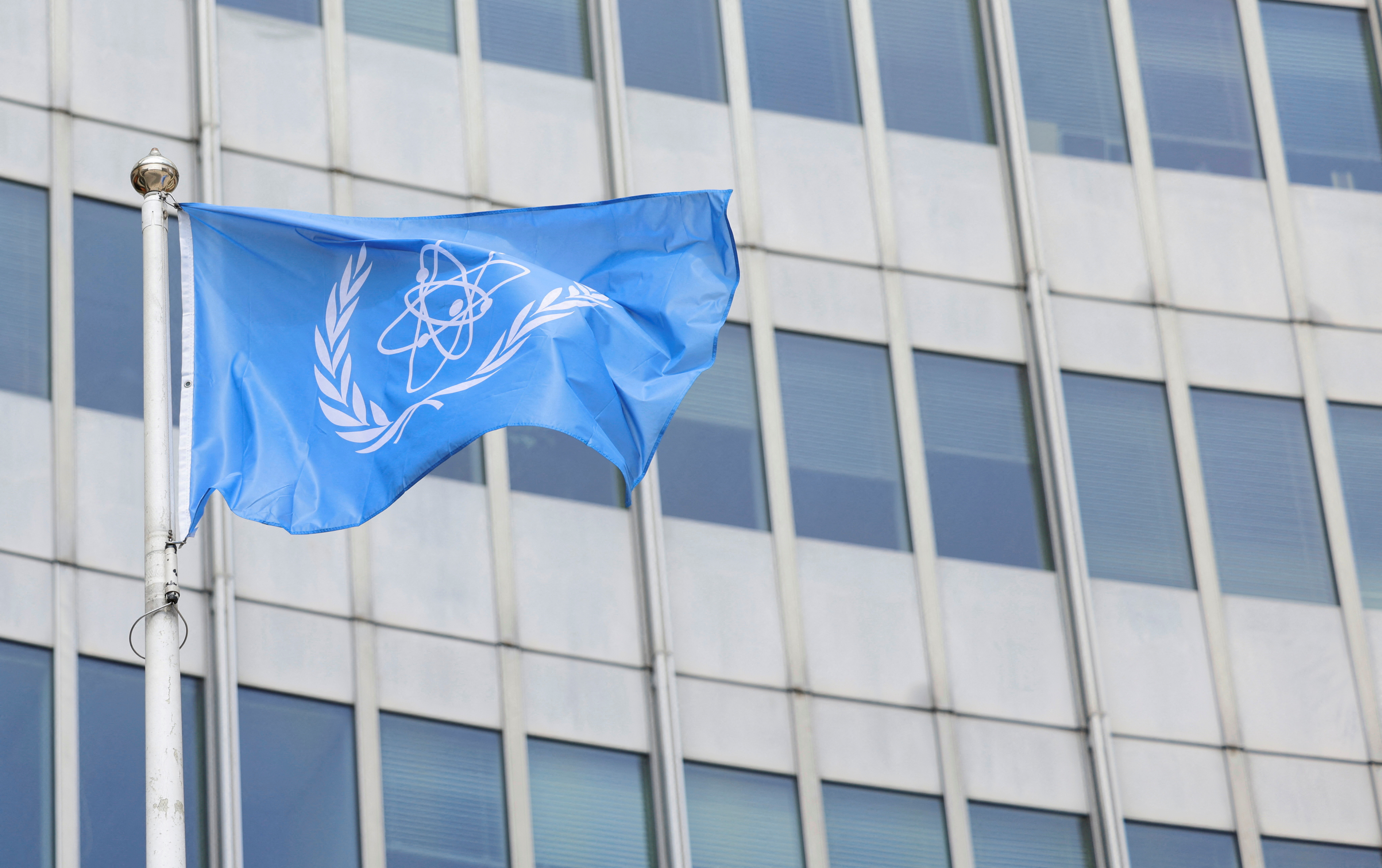 The IAEA flag flutters outside their headquarters in Vienna