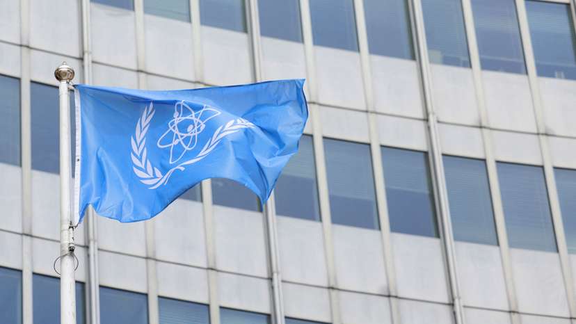The IAEA flag flutters outside their headquarters in Vienna