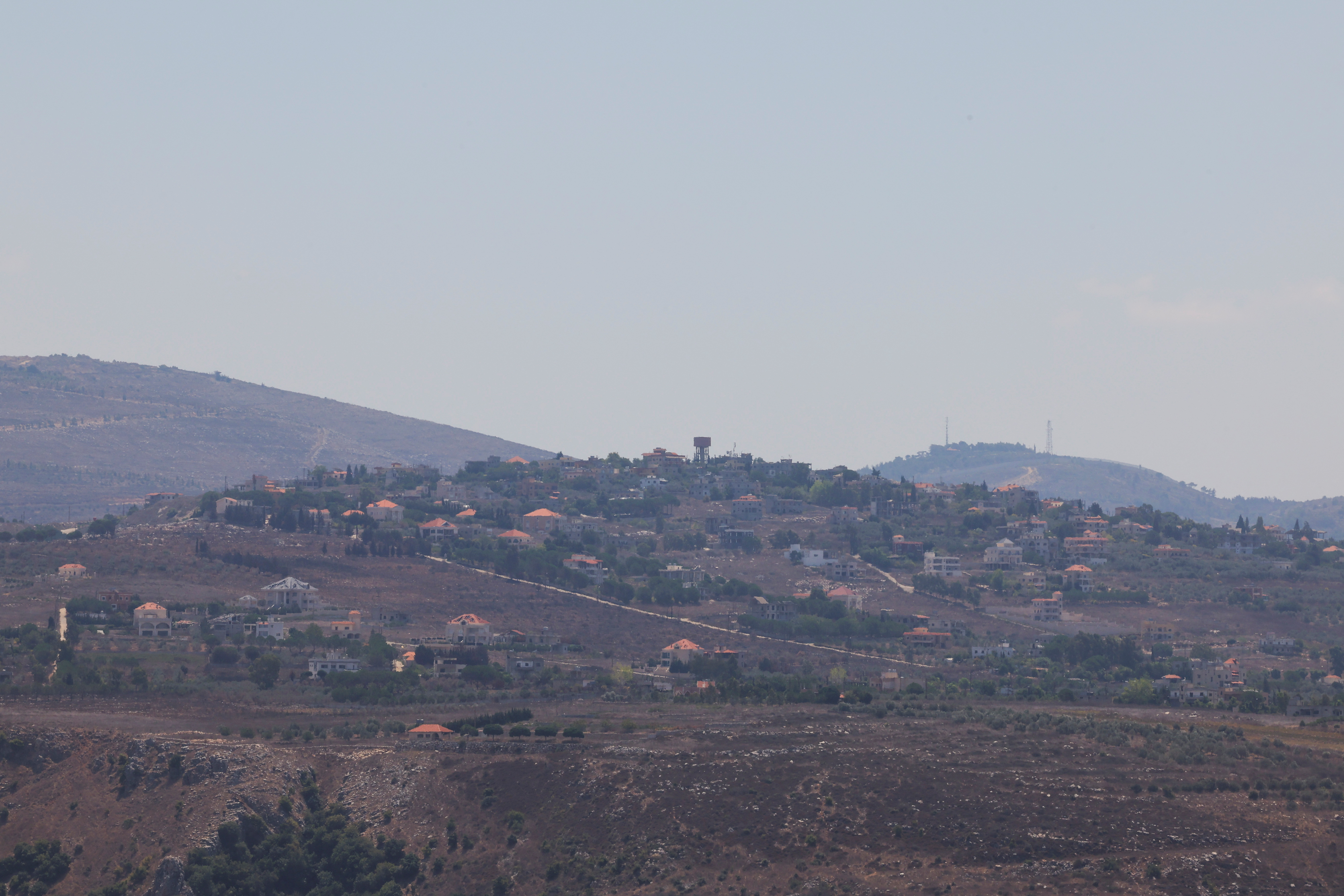 A general view shows villages near the Lebanese-Israeli border, as pictured through a balcony in Kamel Mroue's house, in Yohmor, Nabatieh governorate