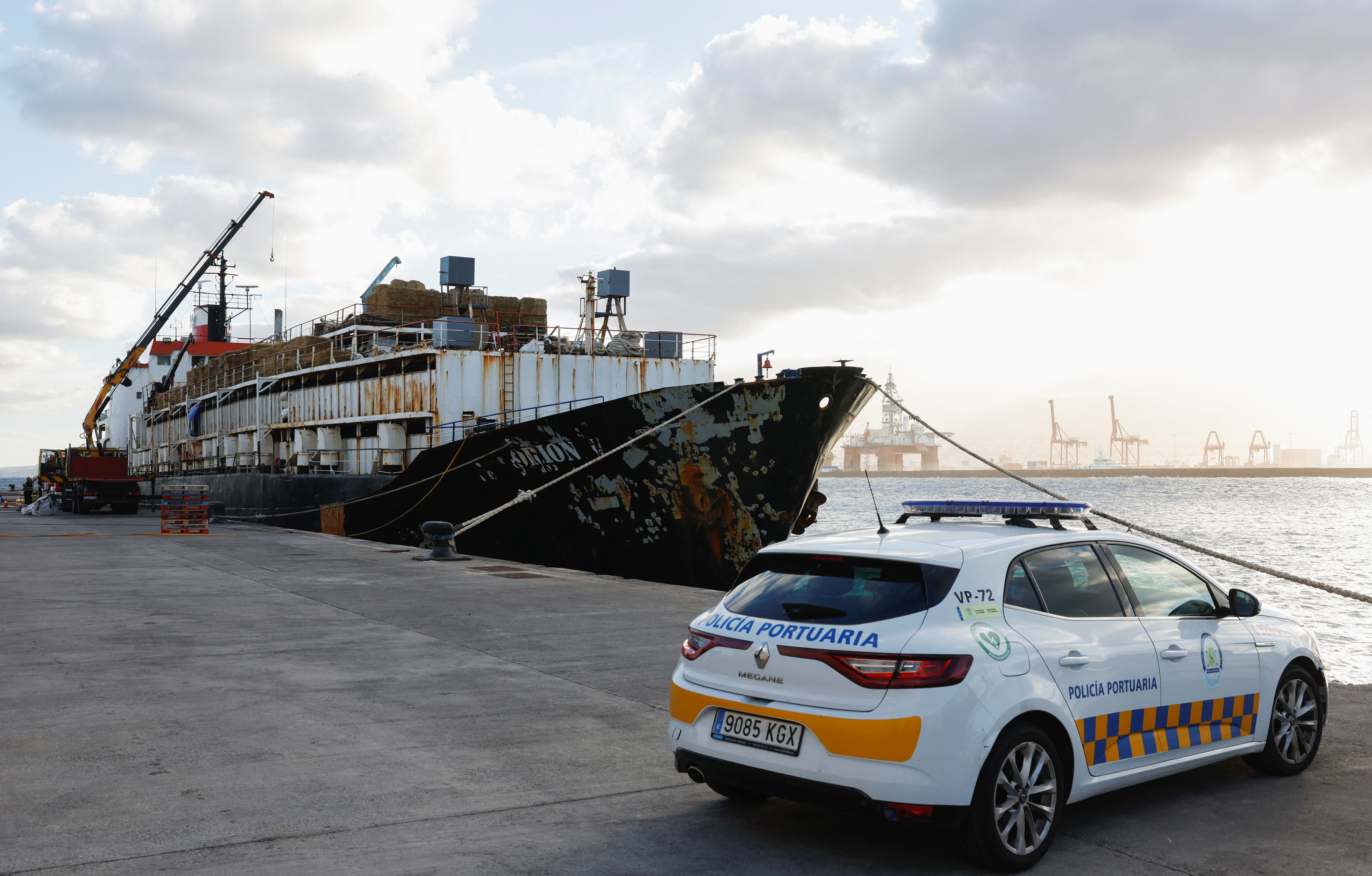 Police officers discharge drugs from the cattle ship Orion V seized off the Canary Islands, in the port of Las Palmas