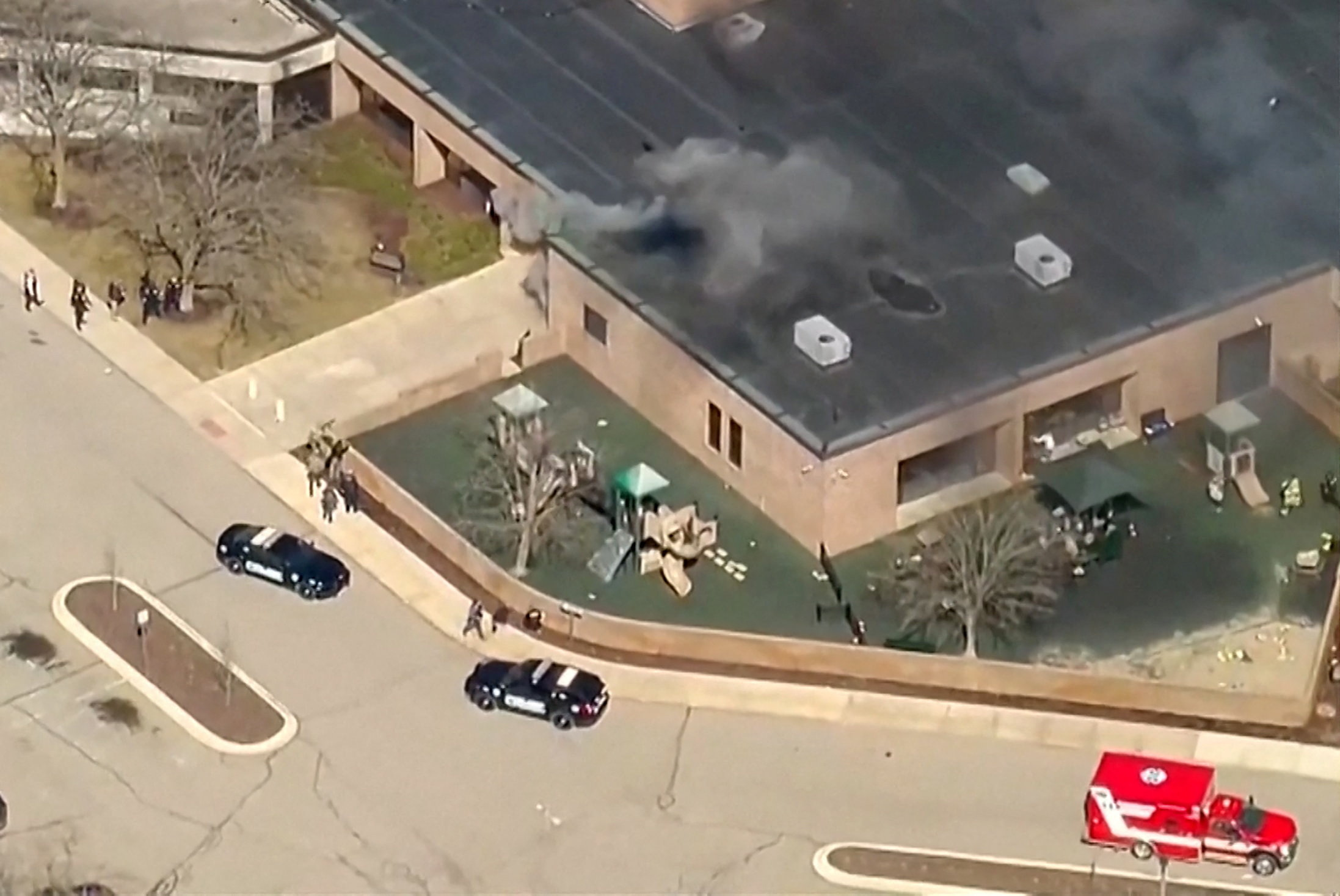 Smoke rises from the building after an active shooting incident was reported at the Temple Israel Synagogue in West Bloomfield