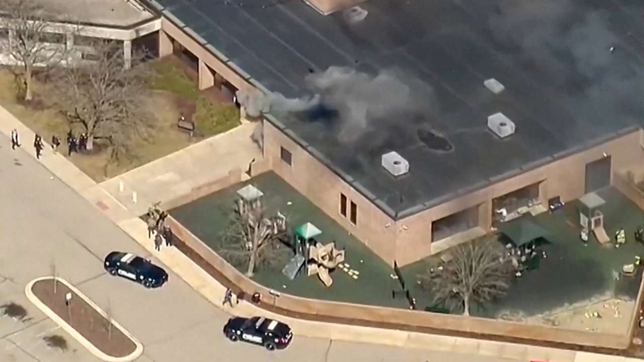 Smoke rises from the building after an active shooting incident was reported at the Temple Israel Synagogue in West Bloomfield