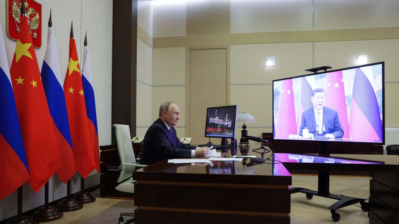 Russian President Vladimir Putin holds a video conference meeting with Chinese President Xi Jinping, outside Moscow