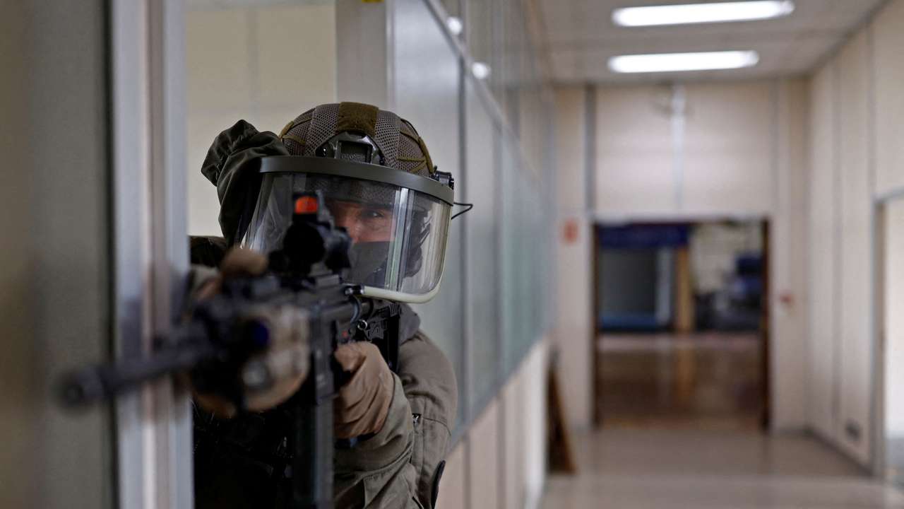 Gendarmes of the French National Gendarmerie Intervention Group (GIGN) take part in a drill near Paris