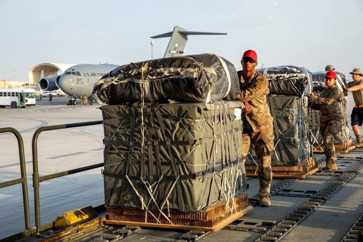 FILE PHOTO: U.S. Air Force members work on the preparation of a humanitarian aid drop for Gaza residents