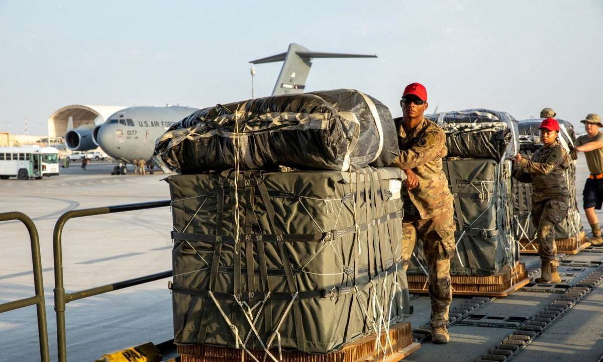 FILE PHOTO: U.S. Air Force members work on the preparation of a humanitarian aid drop for Gaza residents