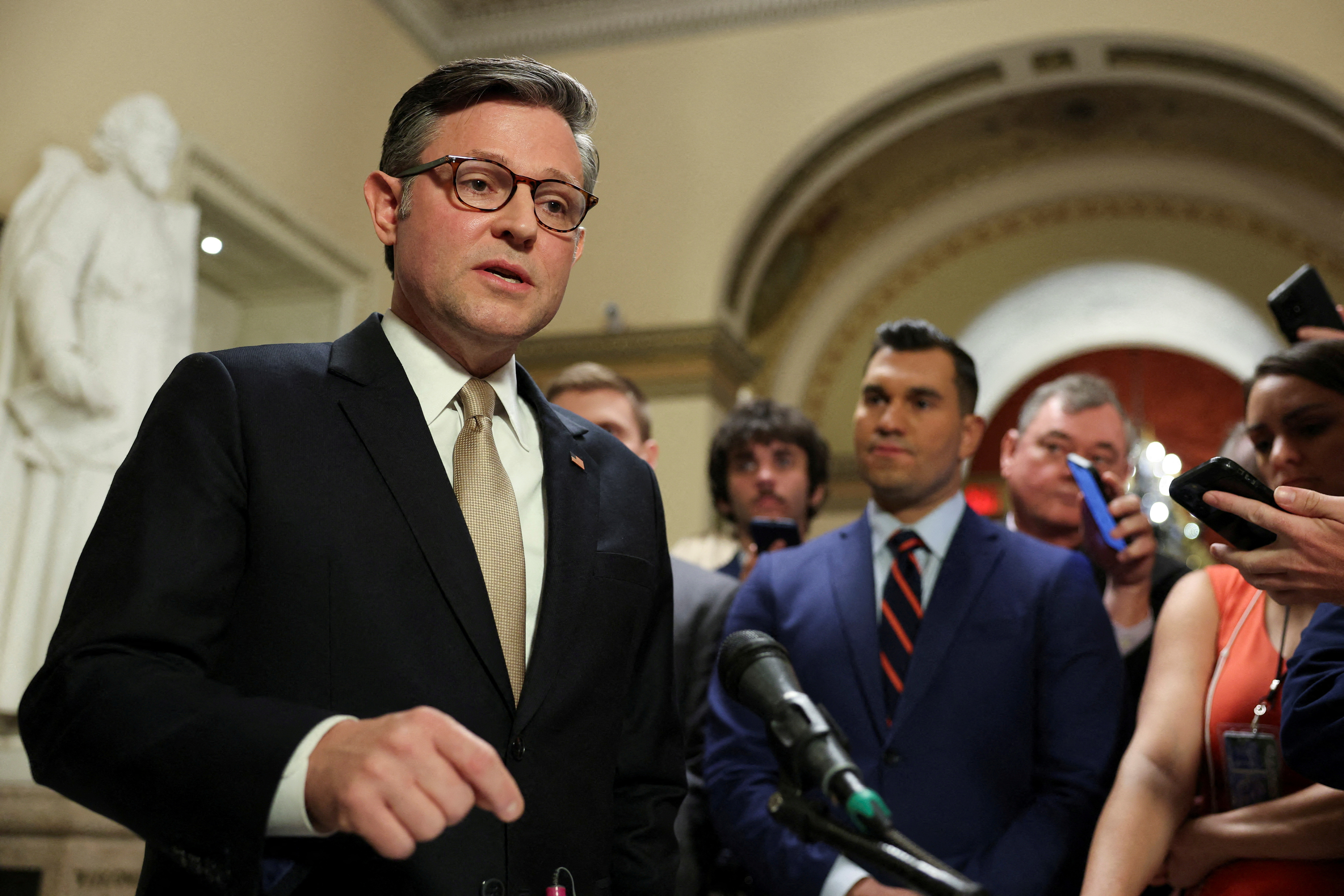 FILE PHOTO: U.S. House Speaker Johnson speaks to reporters at the Capitol in Washington