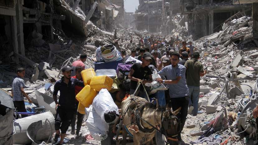 Palestinians inspect the damage after Israeli forces withdrew from Jabalia refugee camp
