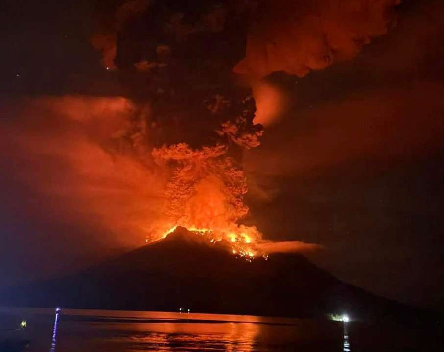 Hot lava flows from Mount Ruang volcano during an eruption in Sitaro