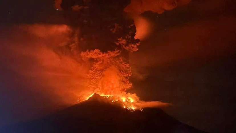 Hot lava flows from Mount Ruang volcano during an eruption in Sitaro