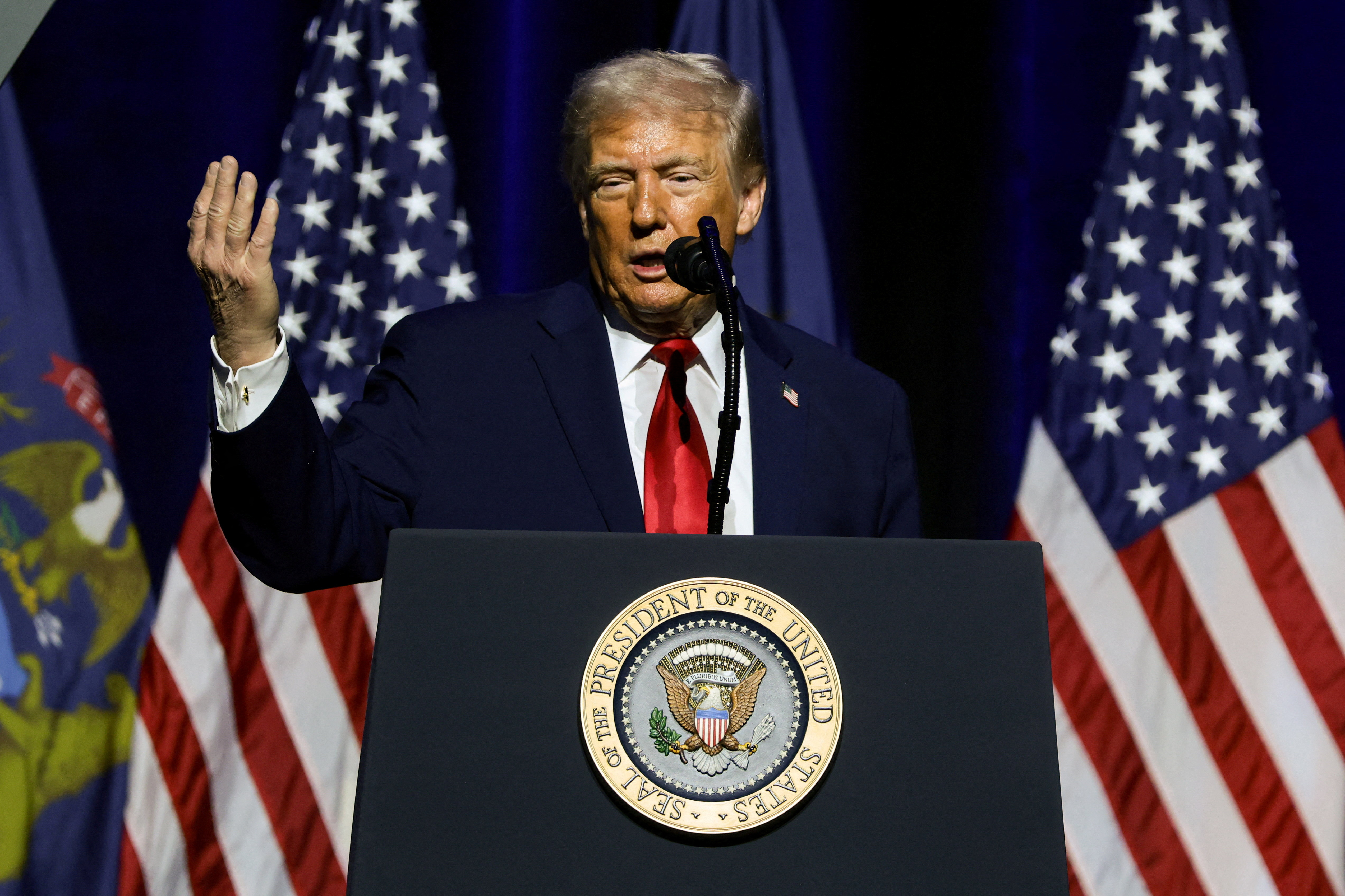 FILE PHOTO: U.S. President Trump delivers remarks at The Detroit Economic Club in Detroit