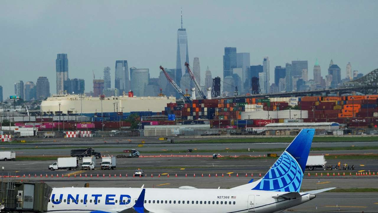 FILE PHOTO: A plane docks on the tarmac at Newark International Airport in Newark, New Jersey