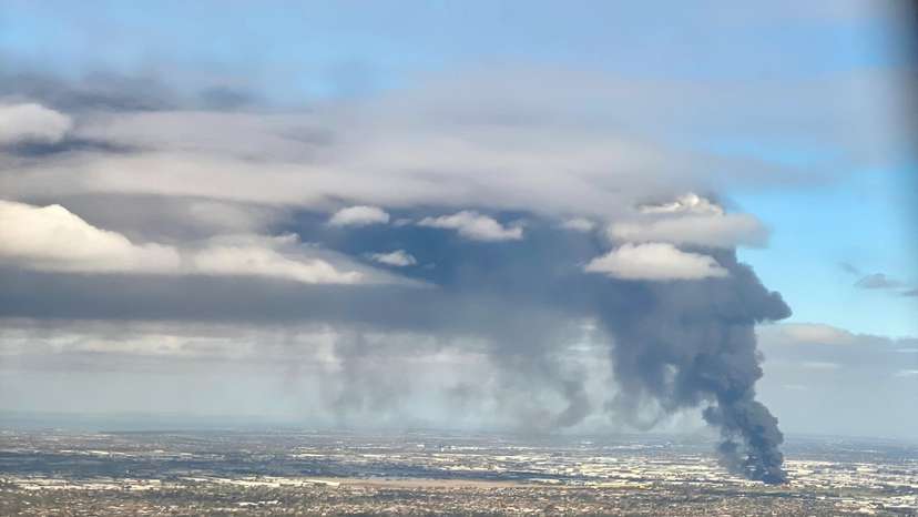 Fire and plumes of smoke rise following an explosion at a factory on the outskirts of Melbourne