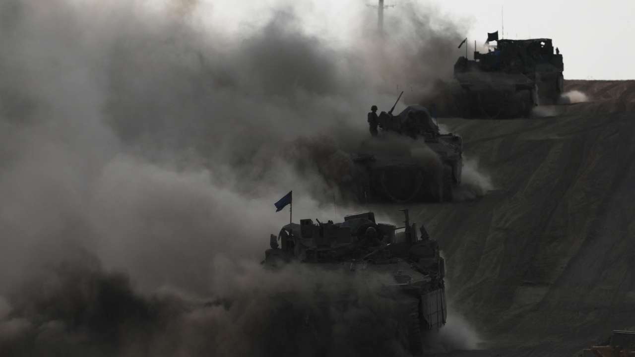 Israeli armoured personnel carriers (APC) operate, amid the ongoing conflict between Israel and the Palestinian Islamist group Hamas, near Israel's border with Gaza in southern Israel